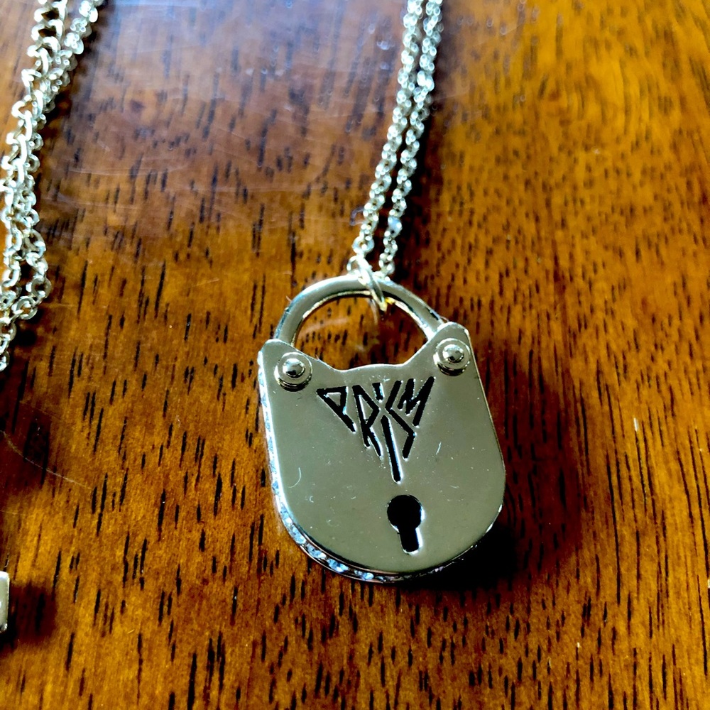 Katy Perry Necklace- gold tone. Lock, key, and cat. It’s in great condition.